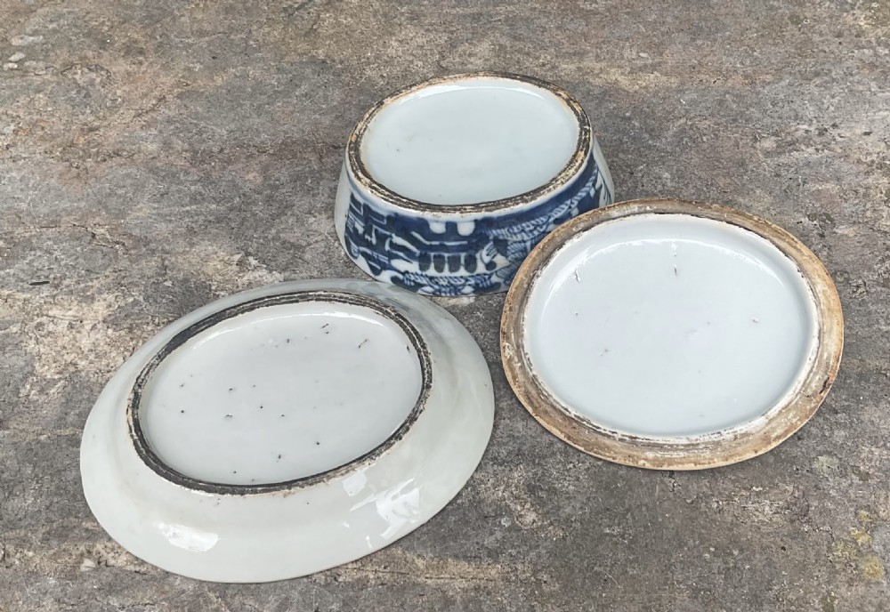 An early nineteenth-century oval Chinese porcelain covered dish on a matching stand decorated with blue and white hand-painted landscape motifs. View V