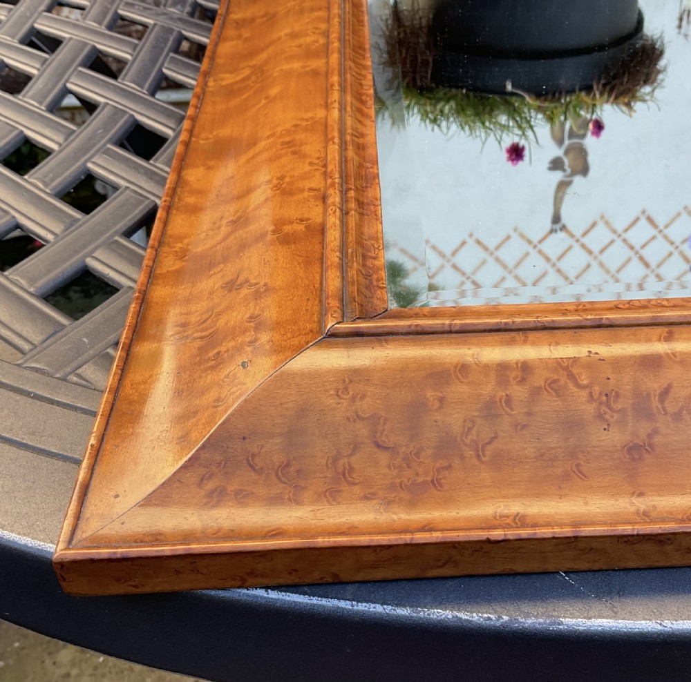 A rectangular Georgian wall mirror featuring a wide, figured burr maple frame with a moulded inner border. View IV