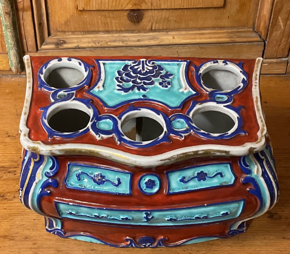 A Chinese export porcelain bough pot shaped like a Rococo commode decorated in terracotta, turquoise, and dark blue enamels with top apertures. View II