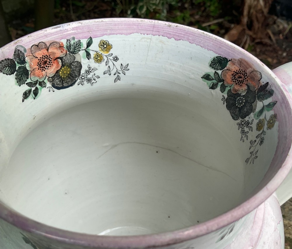 A large 19th-century white earthenware jug featuring pink splash lustre glaze, floral rim motifs, and a detailed Farmers Arms transfer print. View IV