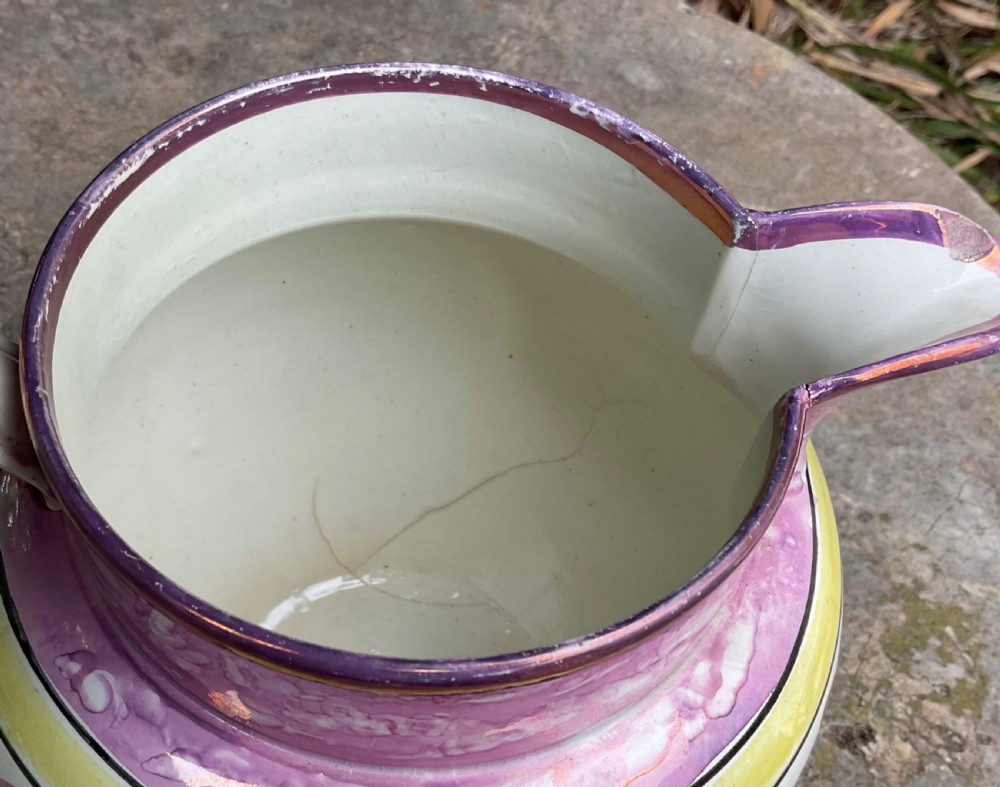 A Georgian Sunderland pink splash lustre pottery jug decorated with a transfer-printed tall ship, verse inscription, and yellow accents. View IV