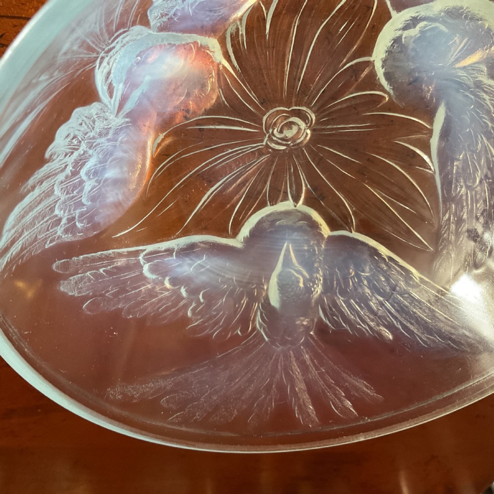 An Art Deco translucent opalescent glass bowl decorated with embossed motifs of birds in flight. View IV