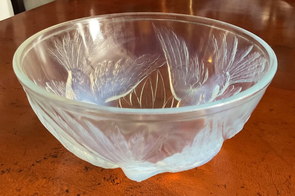 An Art Deco translucent opalescent glass bowl decorated with embossed motifs of birds in flight. View V