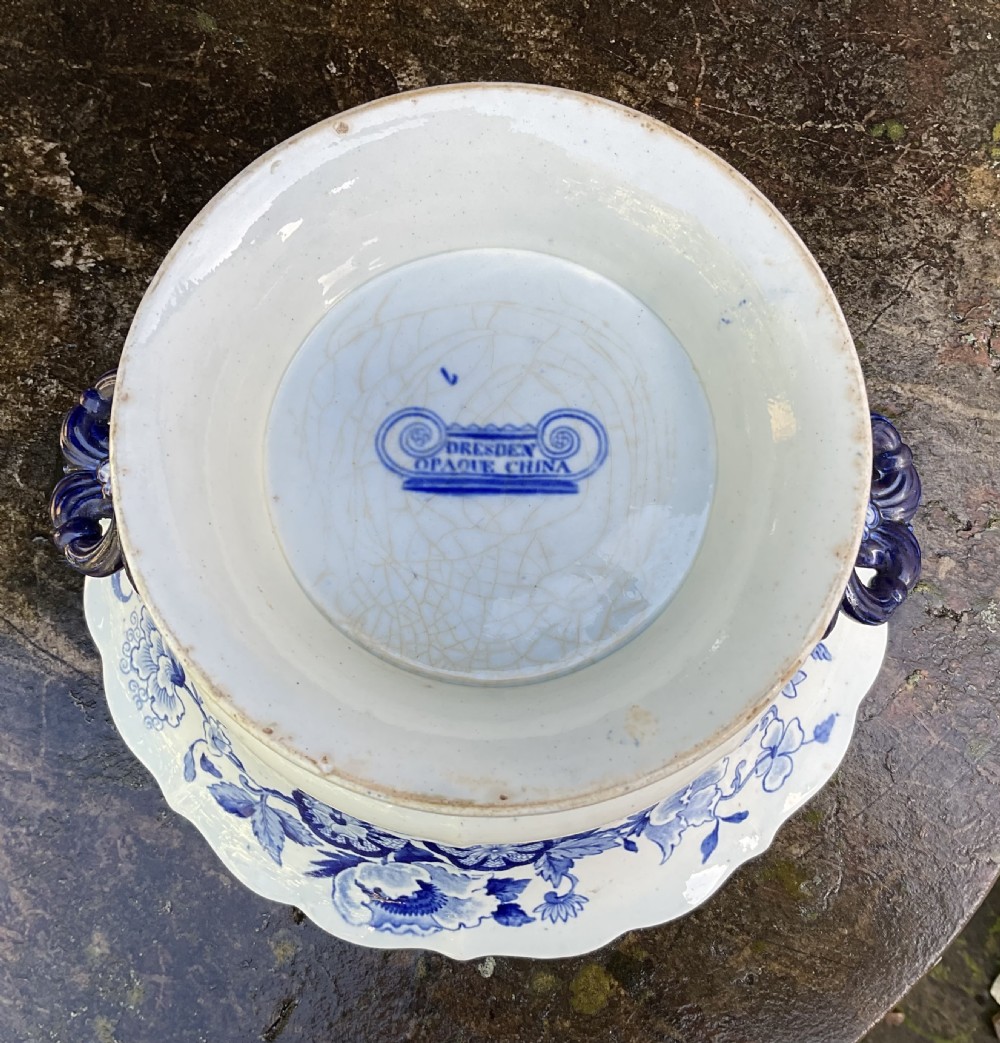 A Georgian blue and white transferware ceramic bowl with twin side handles, a floral pattern, and a raised pedestal foot. View VII