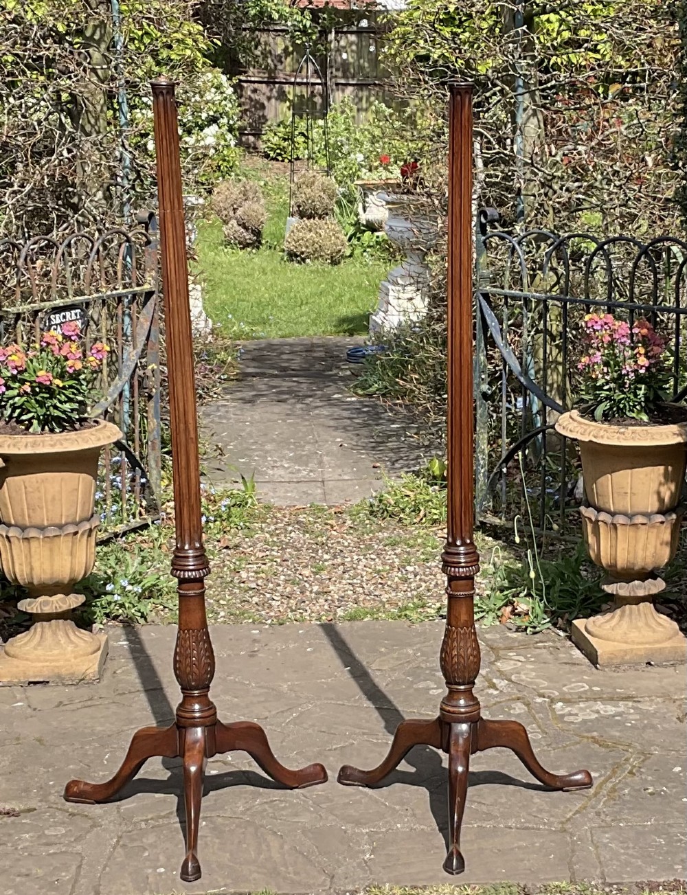 A pair of tall Georgian mahogany standard lamps featuring reeded columns, carved acanthus leaves, and tripod bases with cabriole legs. View II