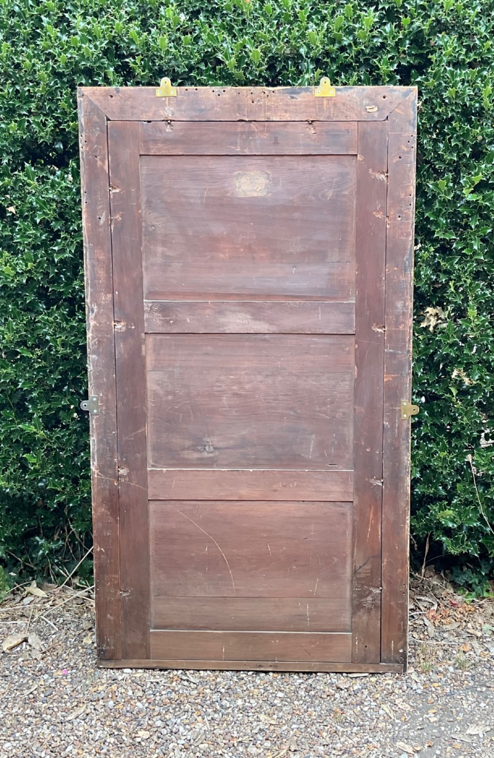 A tall Regency giltwood pier mirror featuring a fluted frame with carved corner rosettes. View V