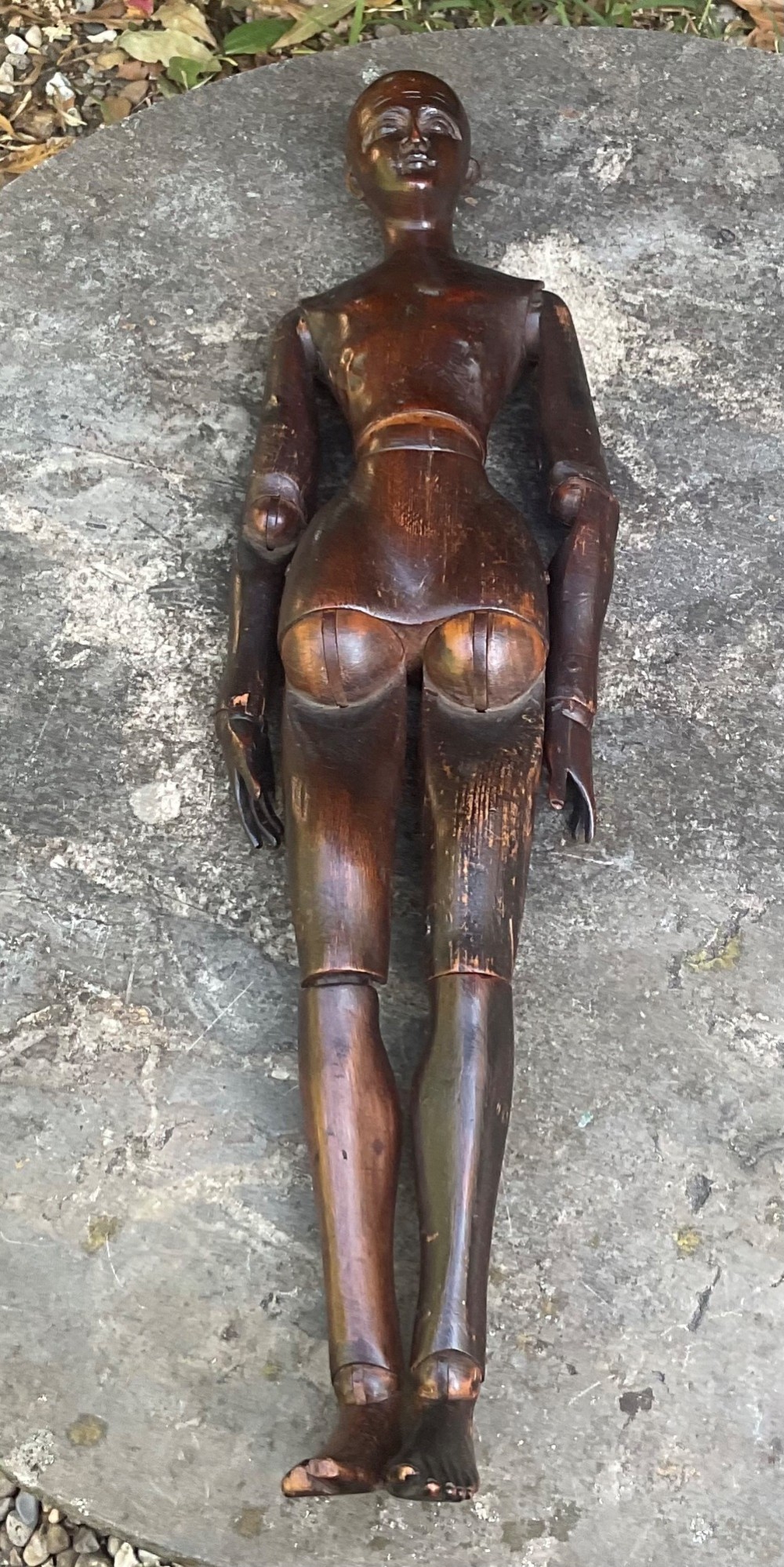 A nineteenth-century articulated carved dark wood artists lay figure seated with crossed legs and posed arms. View III