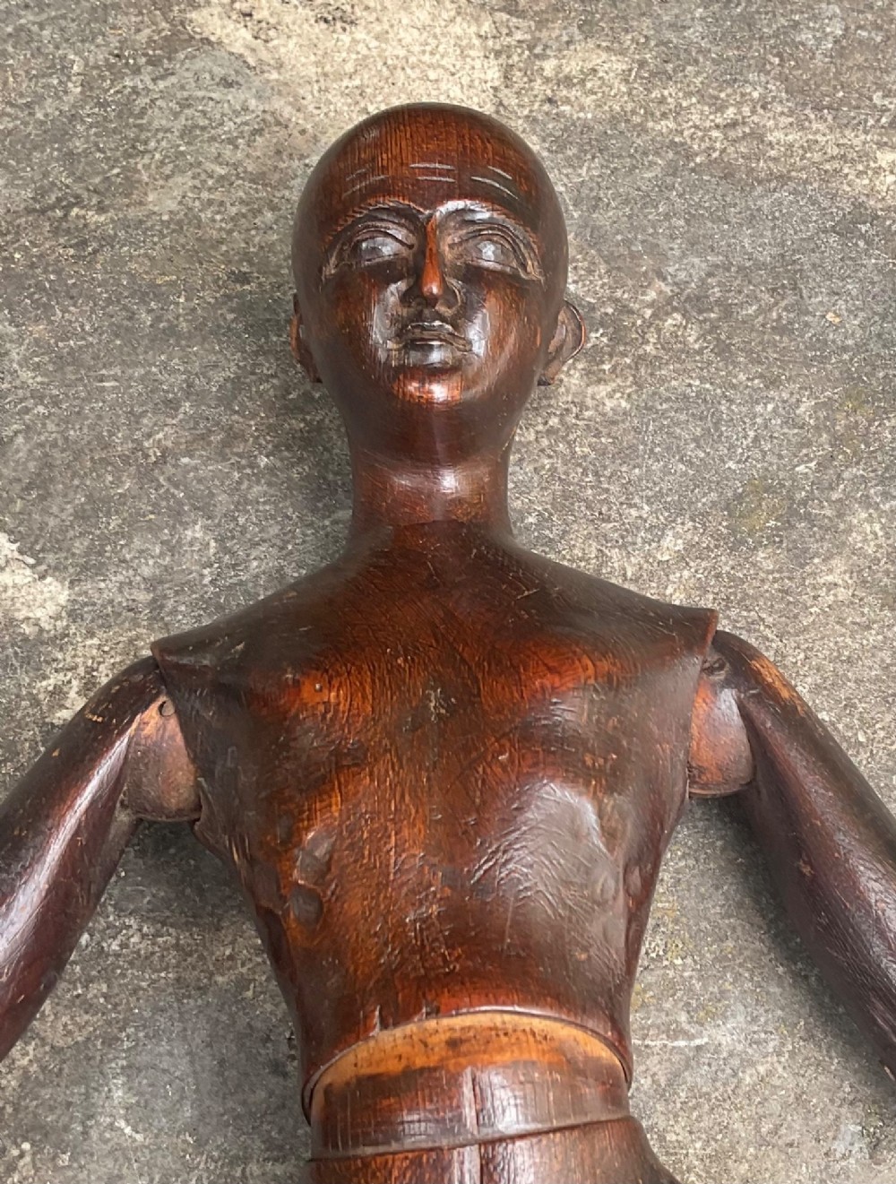 A nineteenth-century articulated carved dark wood artists lay figure seated with crossed legs and posed arms. View X