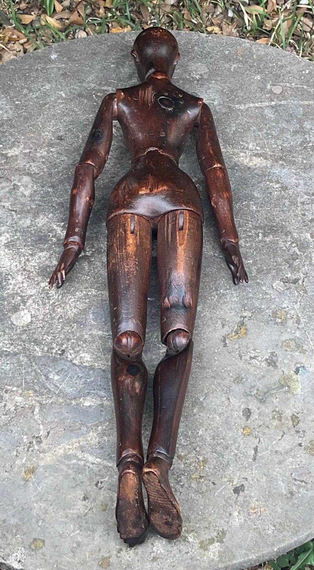 A nineteenth-century articulated carved dark wood artists lay figure seated with crossed legs and posed arms. View XIII