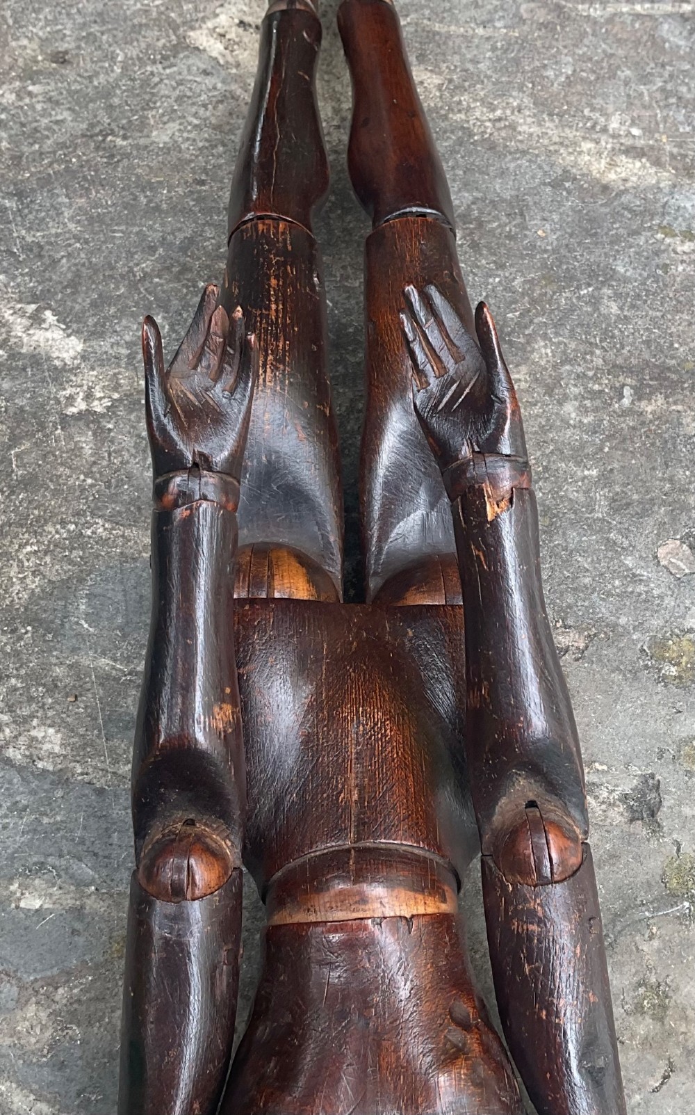 A nineteenth-century articulated carved dark wood artists lay figure seated with crossed legs and posed arms. View XIV