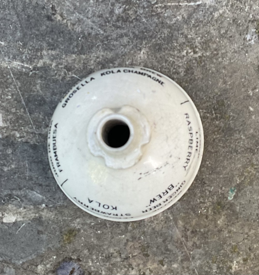 A cream glazed ceramic funnel printed with black Edwardian commercial typography for Prana Fruit Crystals. View VI