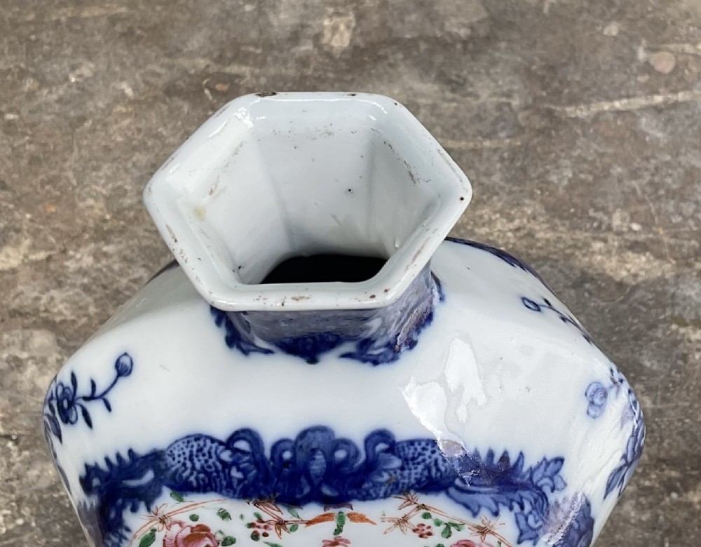 An 18th-century Chinese porcelain vase featuring cobalt blue framed panels enclosing hand-painted pink and orange enamel floral cartouches. View V