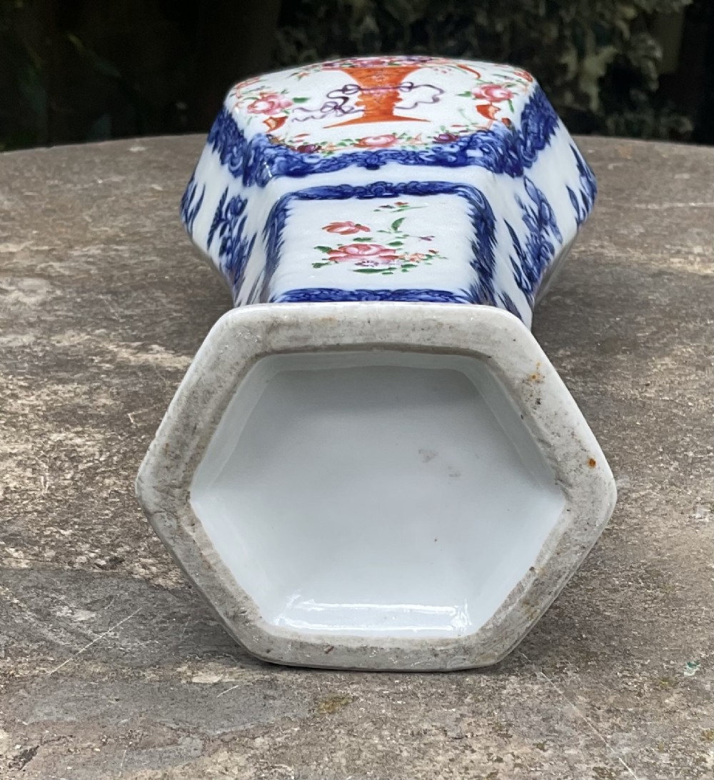 An 18th-century Chinese porcelain vase featuring cobalt blue framed panels enclosing hand-painted pink and orange enamel floral cartouches. View VI