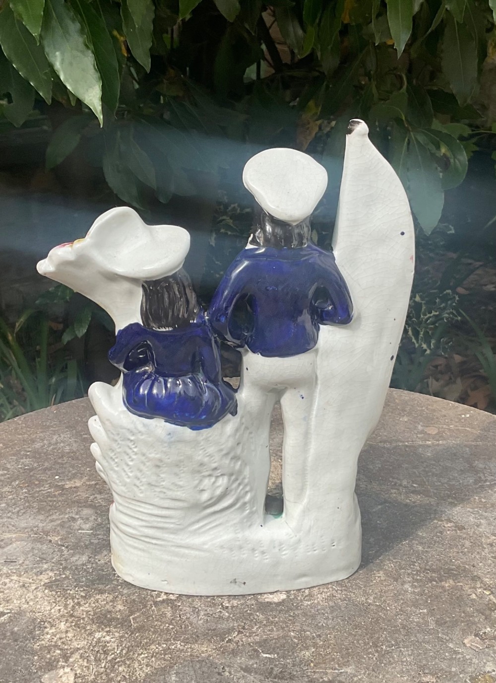 A Victorian Staffordshire earthenware flatback figure group depicting a sailor holding a flag alongside a female figure holding a sheaf of corn. View III