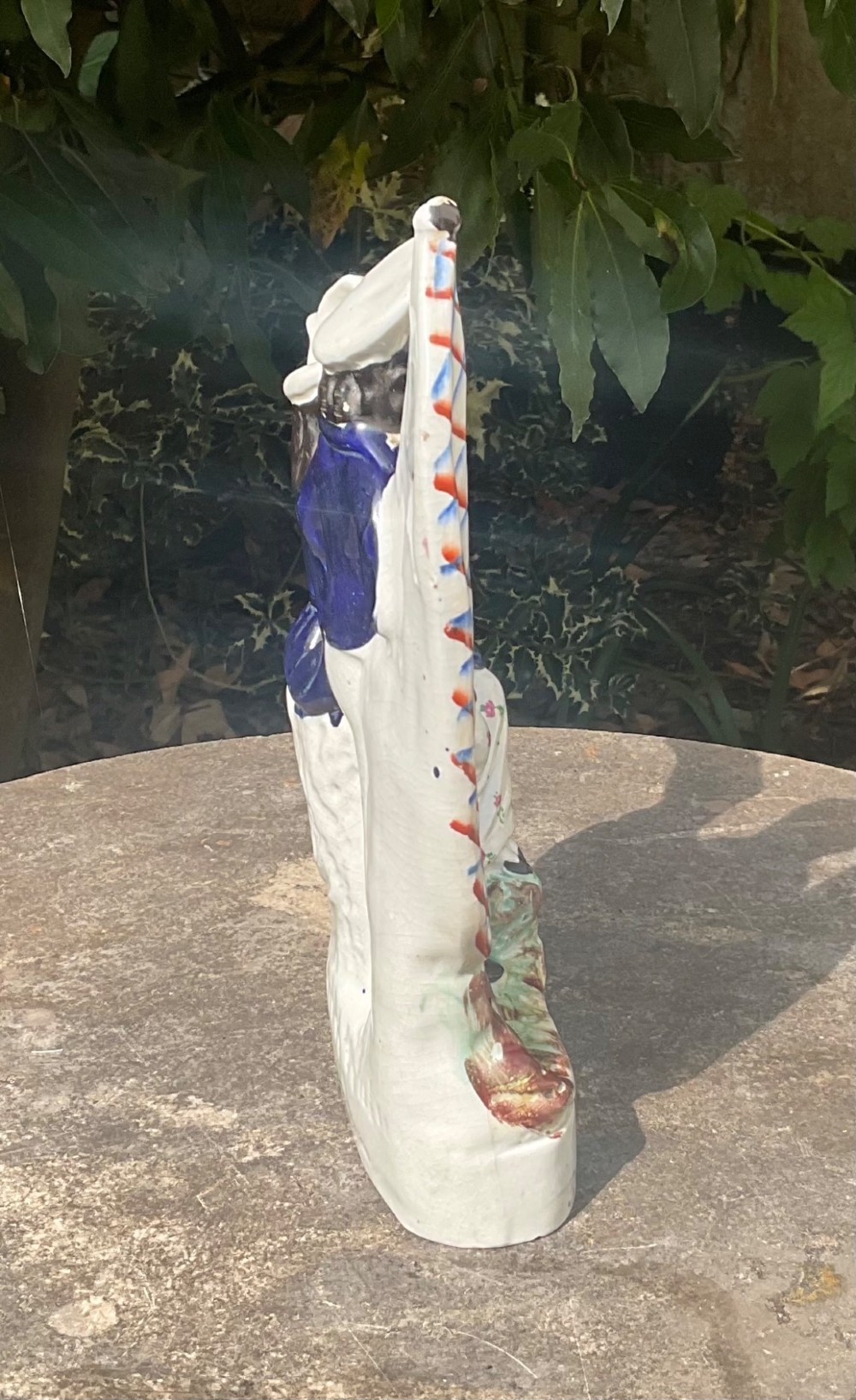 A Victorian Staffordshire earthenware flatback figure group depicting a sailor holding a flag alongside a female figure holding a sheaf of corn. View IV