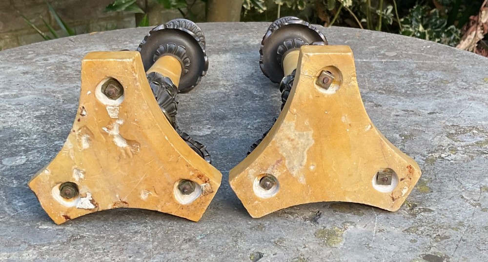 A pair of Regency period candlesticks with yellow marble column stems, classical dark bronze sconces, acanthus collars, and bronze paw feet on triform marble bases. View III