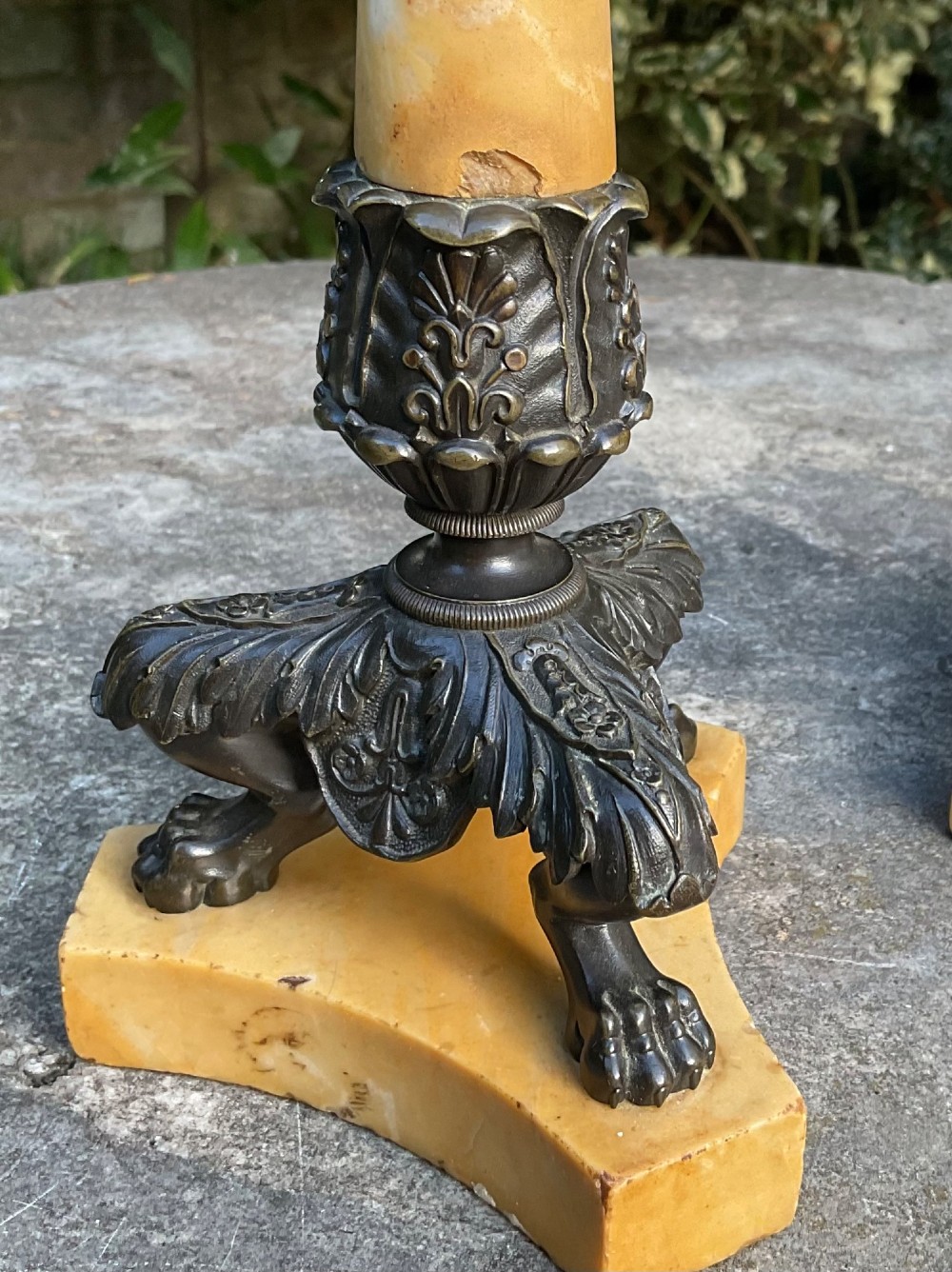 A pair of Regency period candlesticks with yellow marble column stems, classical dark bronze sconces, acanthus collars, and bronze paw feet on triform marble bases. View IV