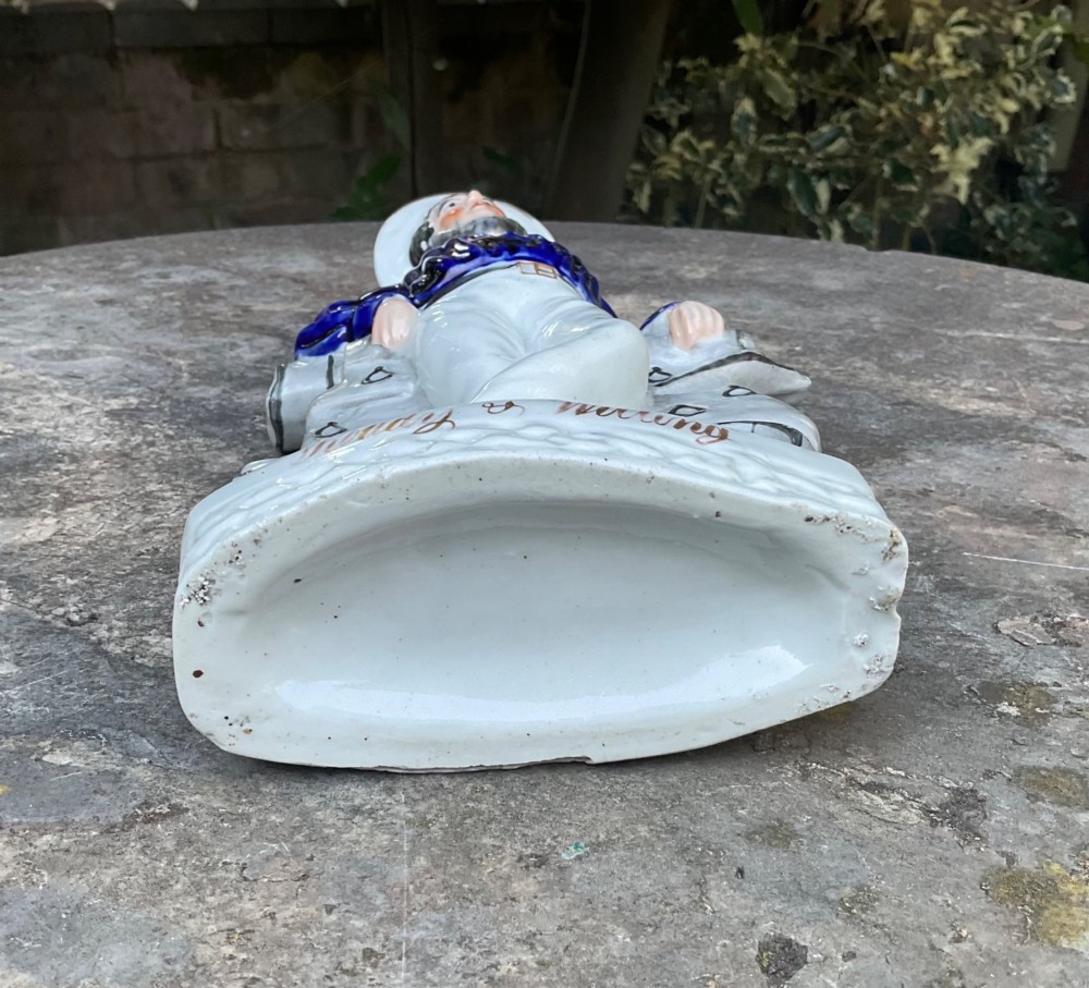 A Victorian Staffordshire earthenware figure depicting an English sailor leaning on a cannon with the base inscribed Ready and Willing. View VII