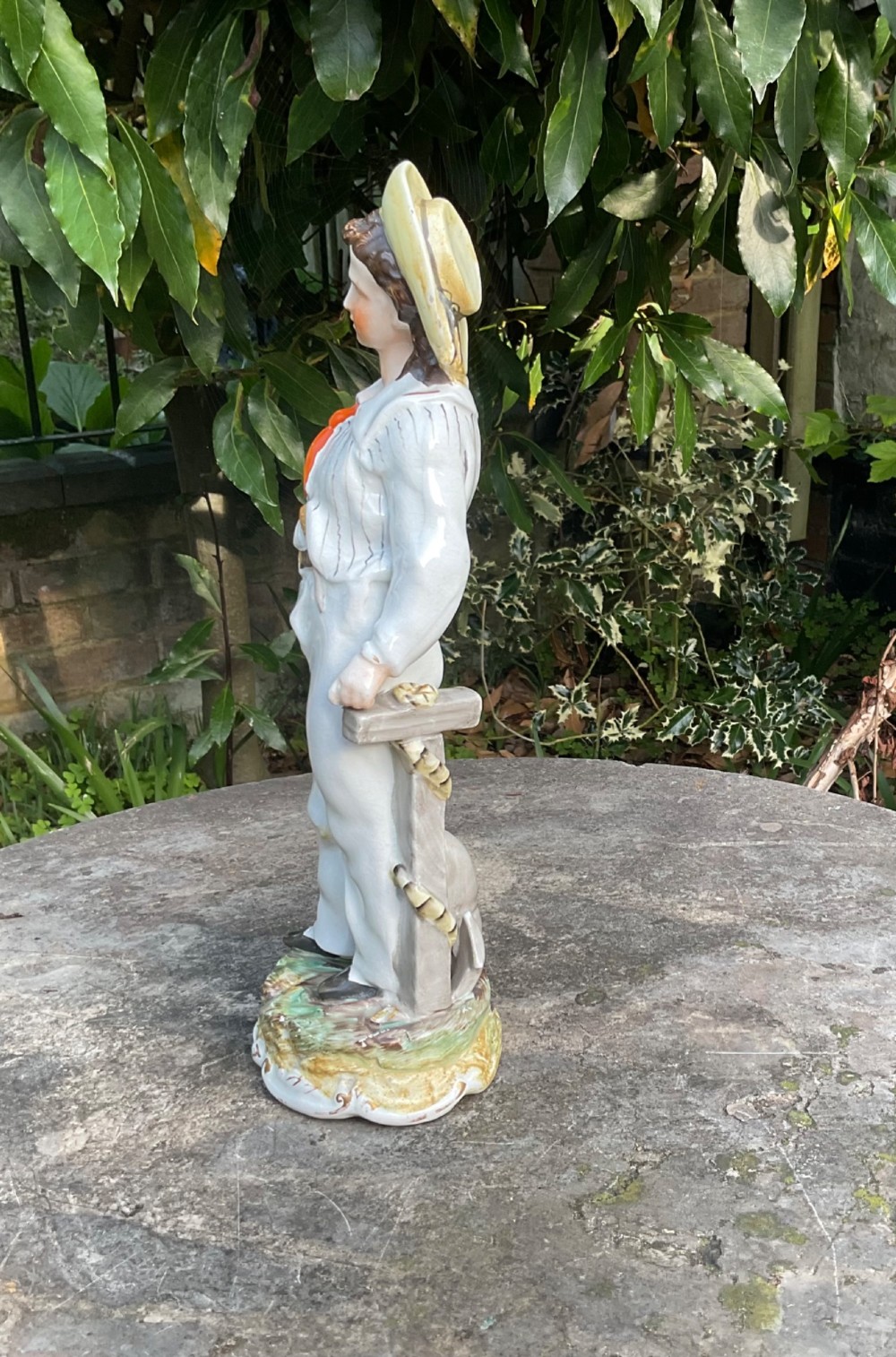 A Victorian Staffordshire earthenware figure depicting Prince Alfred in a sailor uniform on a polychrome moulded base. View II