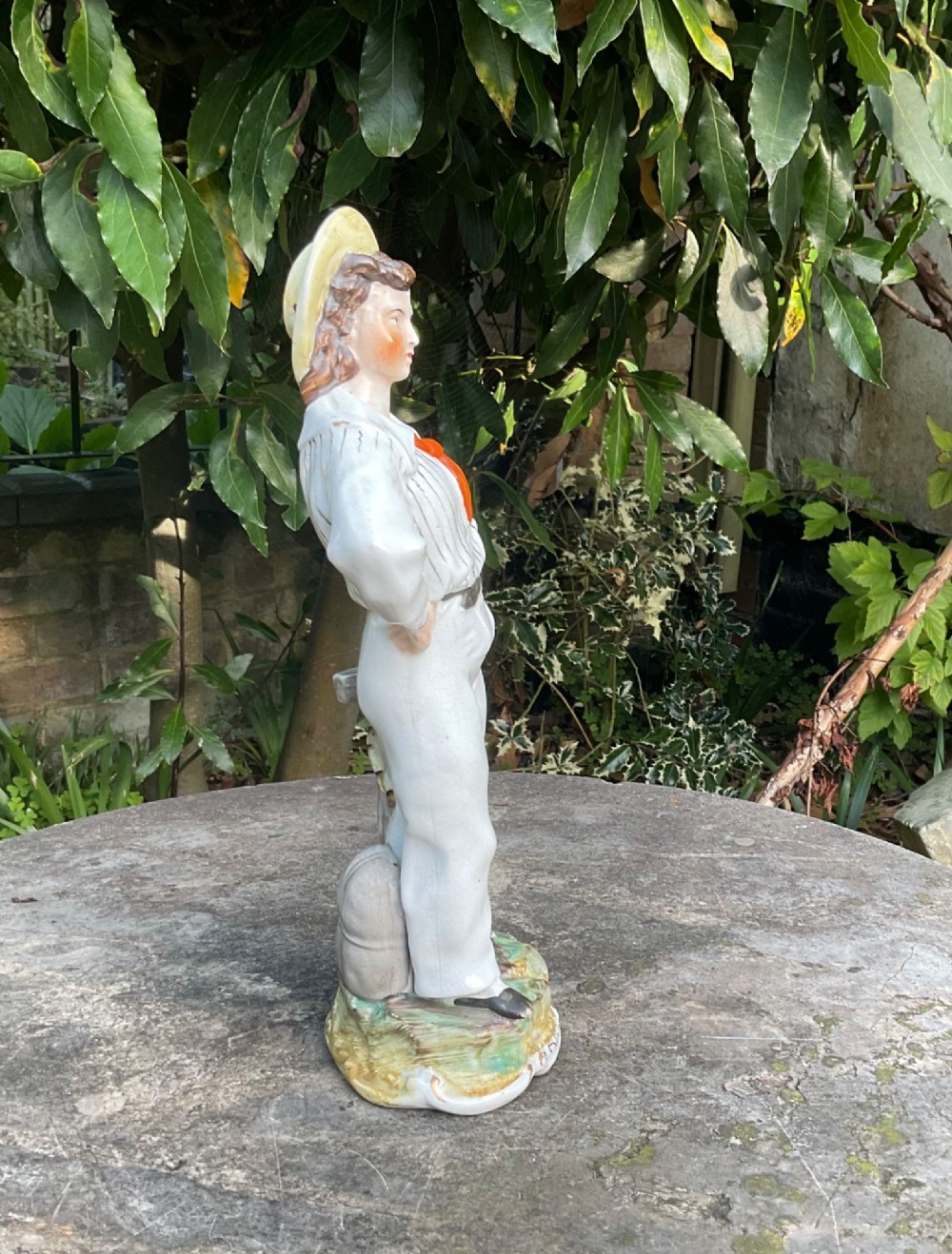 A Victorian Staffordshire earthenware figure depicting Prince Alfred in a sailor uniform on a polychrome moulded base. View IV