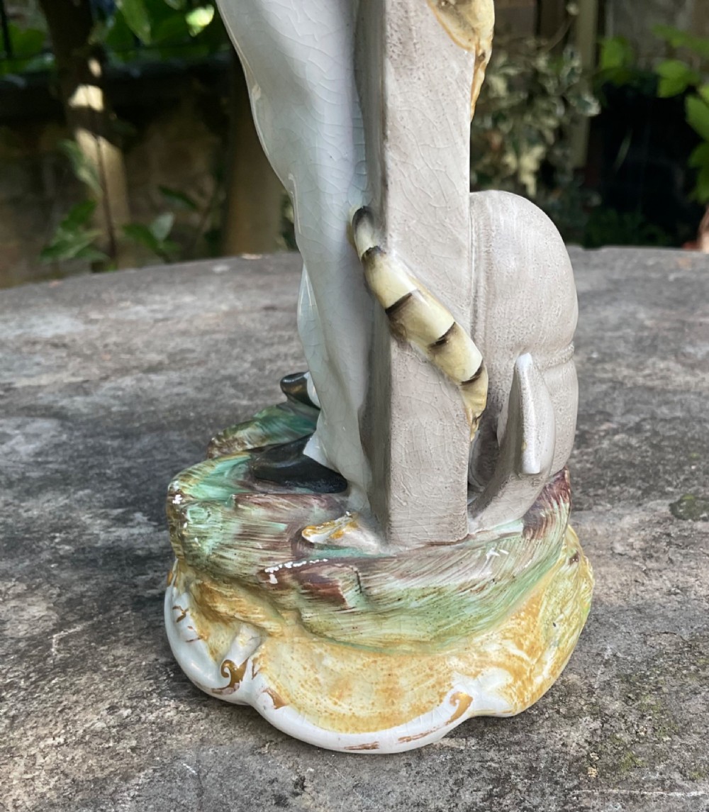 A Victorian Staffordshire earthenware figure depicting Prince Alfred in a sailor uniform on a polychrome moulded base. View V