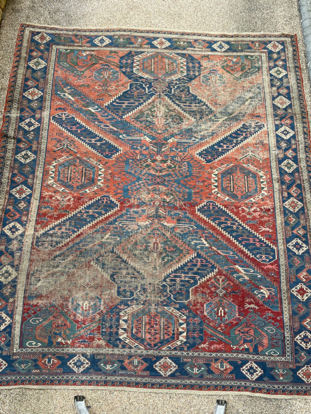 An antique Caucasian Dragon Soumak flatweave wool rug featuring geometric diamond medallions and dragon motifs in terracotta red, navy blue, and teal green. View VII
