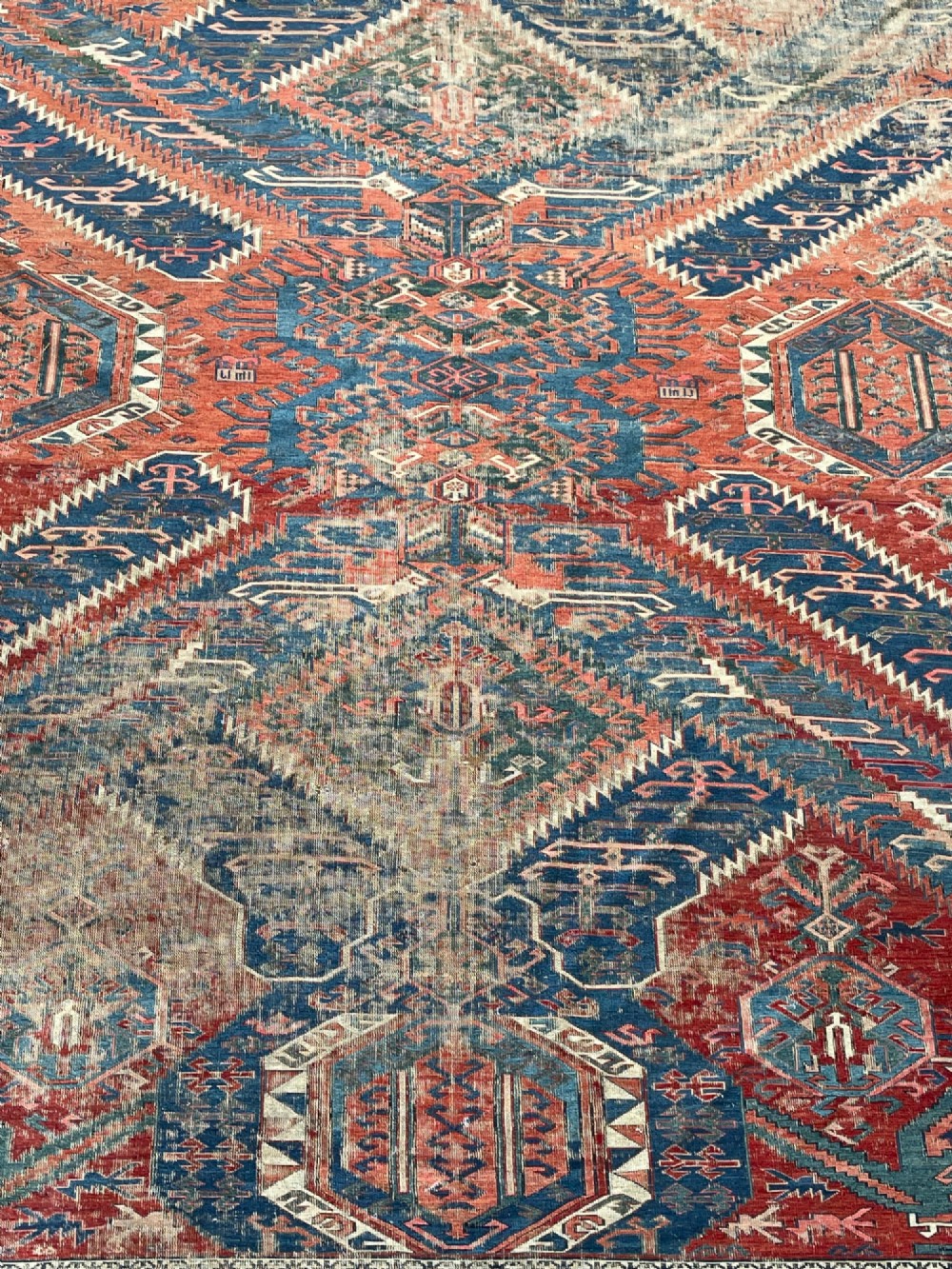 An antique Caucasian Dragon Soumak flatweave wool rug featuring geometric diamond medallions and dragon motifs in terracotta red, navy blue, and teal green. View VIII