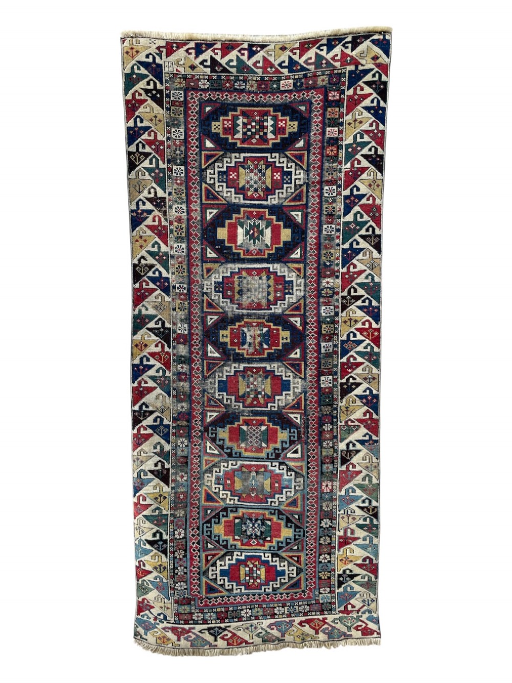 A long hand-knotted wool Shirvan runner rug featuring a central row of geometric stepped medallions framed by detailed multi-coloured bird and hook borders. View II