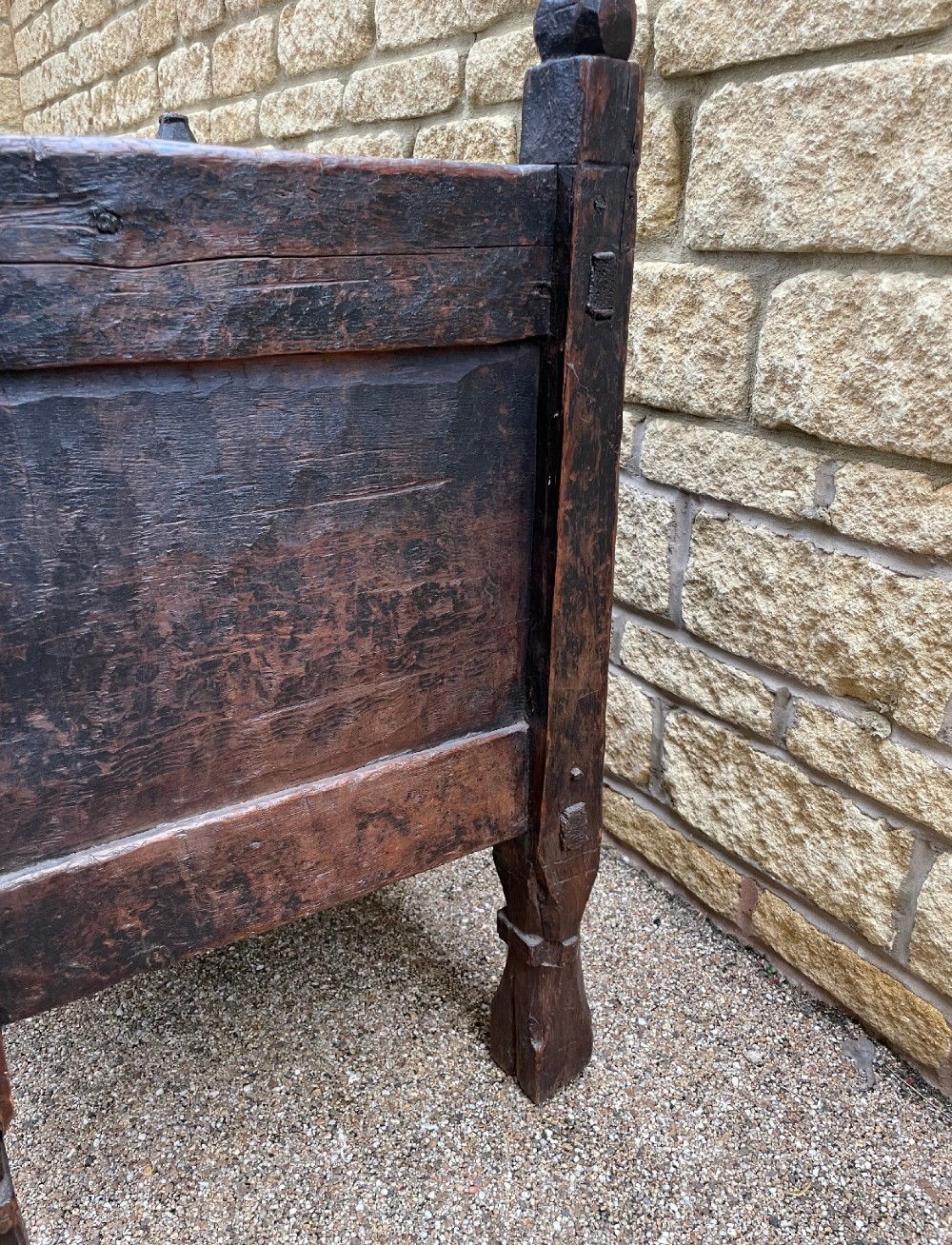 A hand-carved dark wood Swat Valley dowry chest featuring geometric rosettes, corner posts, and an open lattice gallery along the top edge. View IX