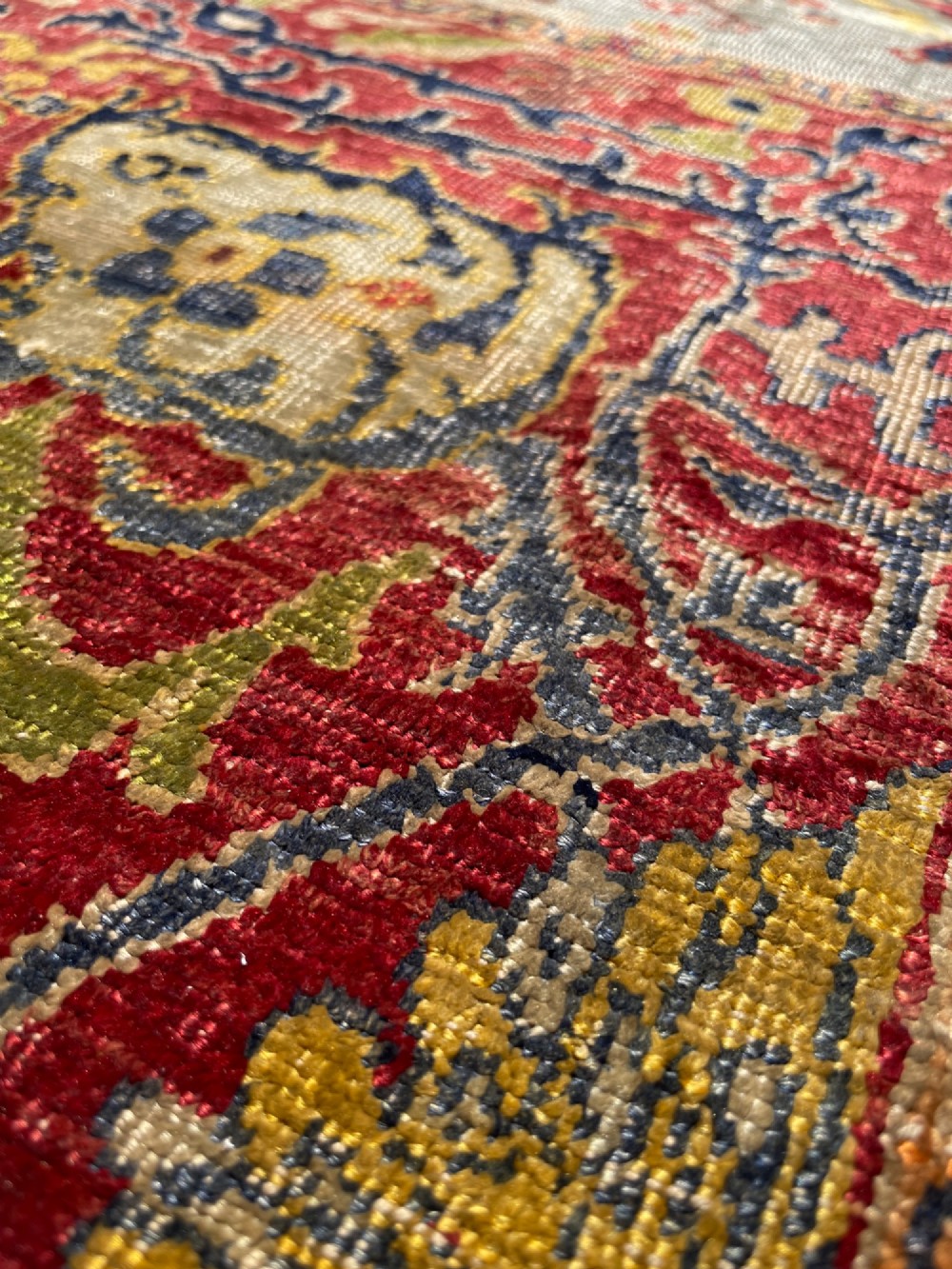 A 19th-century Anatolian silk prayer rug featuring a central gold niche with a hanging lamp motif, enclosed by navy blue and crimson floral borders. View II
