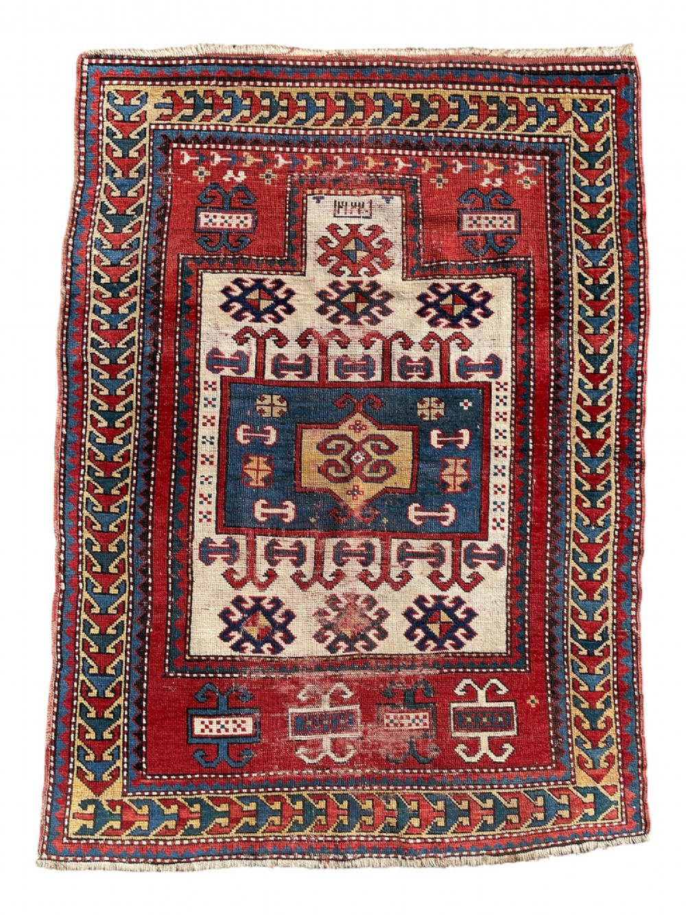 An antique hand-knotted Caucasian Karachov prayer rug featuring a red, ivory, blue, and yellow geometric pattern with a central stepped prayer arch. View VIII