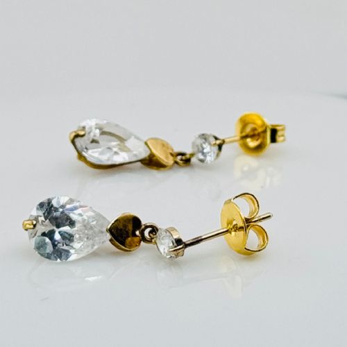 fig 1. A pair of yellow gold drop earrings featuring top stud settings, central heart charms, and faceted teardrop crystals.