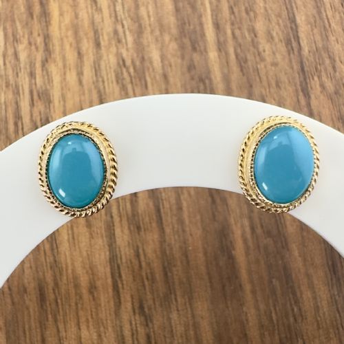 fig 1. A pair of oval turquoise cabochon stud earrings set in 9ct yellow gold with rope twist border detail.