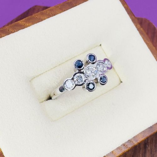 Platinum Five Stone Diamond (0.50ct) and Sapphire Ring, 5.0g 