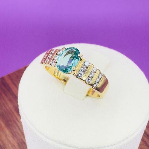 18ct Gold Oval Cut Emerald and Diamond (0.40ct) Cluster Ring