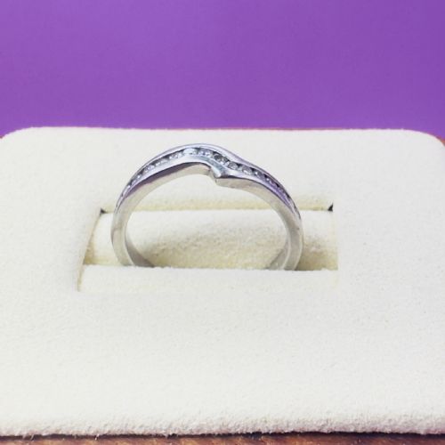 fig 1. A platinum off-centre wishbone band channel-set with round brilliant-cut diamonds across the upper half.