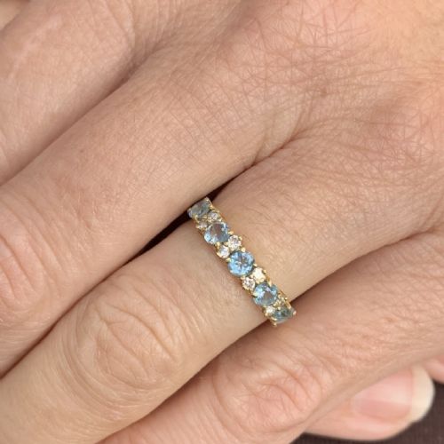 18CT GOLD BLUE SPINEL AND DIAMOND HALF ETERNITY RING