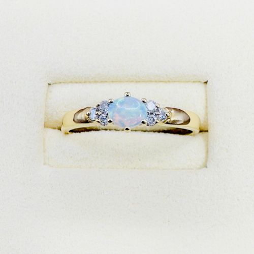 18CT GOLD OVAL CUT EAST TO WEST SET OPAL AND DIAMOND 012CT CLUSTER RING