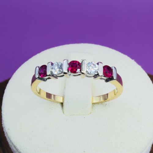 18CT GOLD FIVE STONE RUBY AND DIAMOND 015CT BAND RING