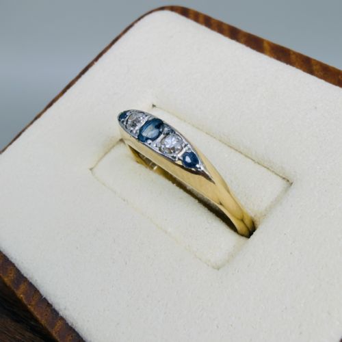 fig 1. An 18ct yellow gold five-stone ring set alternately with three blue sapphires and two old European cut diamonds.