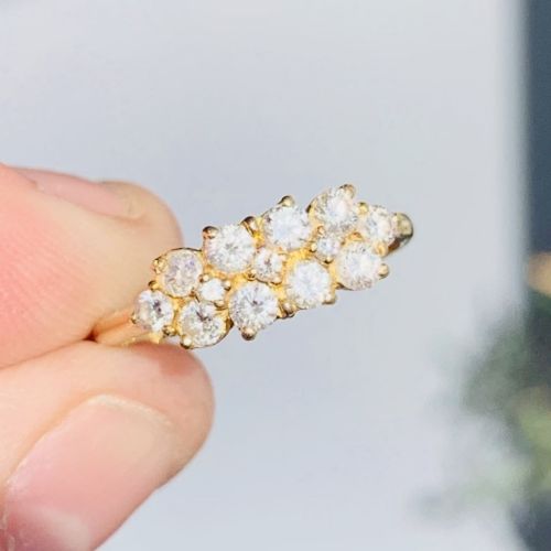 fig 1. An 18ct yellow gold Art Deco cluster ring set with ten old European cut diamonds arranged in a contoured multi-row setting.