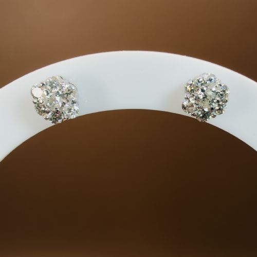 fig 1. A pair of 18ct white gold cluster stud earrings featuring brilliant-cut diamonds arranged in a floral design.