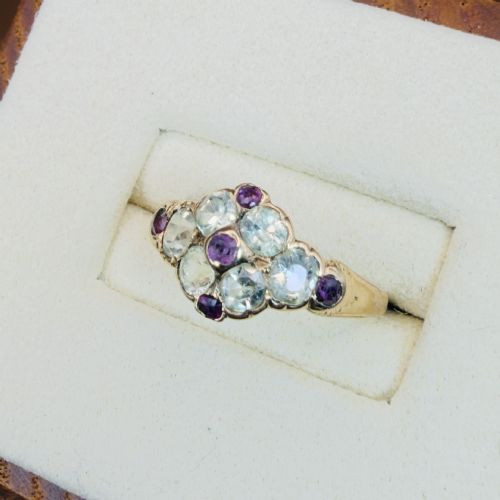 fig 2. An 18ct yellow gold early Victorian cluster ring set with pale green spinels, rubies, and purple almandine garnets.
