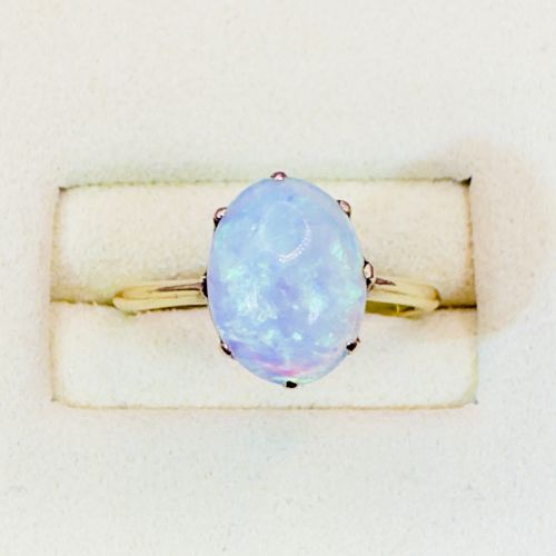 fig 1. An 18ct yellow gold Victorian solitaire ring featuring an oval cabochon opal in a claw setting.