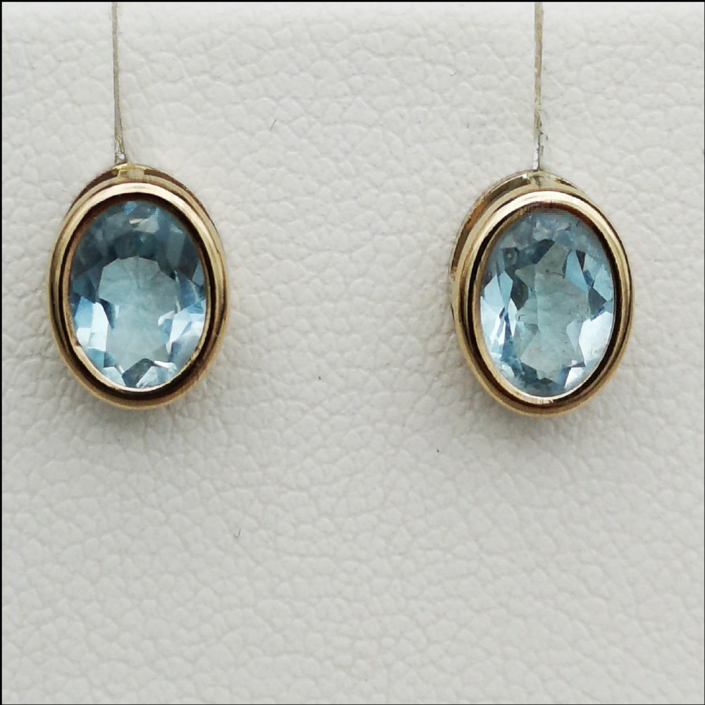 A Pair of 9ct Gold Blue Topaz Stud Earrings