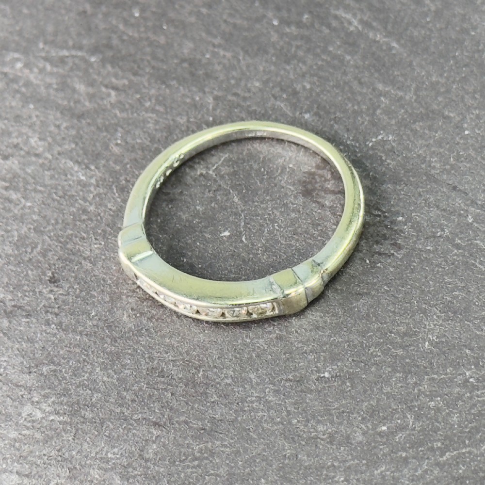 A 9ct gold half eternity ring featuring a channel-set row of round diamonds along the band. View III