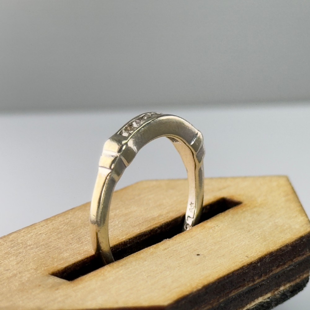 A 9ct gold half eternity ring featuring a channel-set row of round diamonds along the band. View XI
