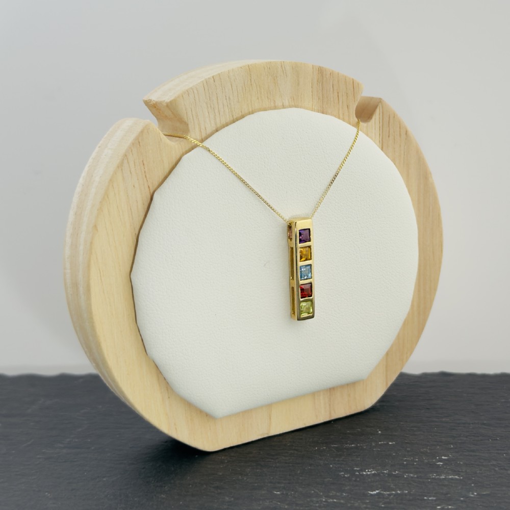 A 9ct yellow gold vertical bar pendant containing five square-cut multi-coloured gemstones suspended from a delicate gold chain. View IX