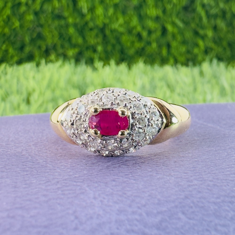 18ct Gold Oval Cut Ruby and Diamond (0.50ct) Cluster Ring