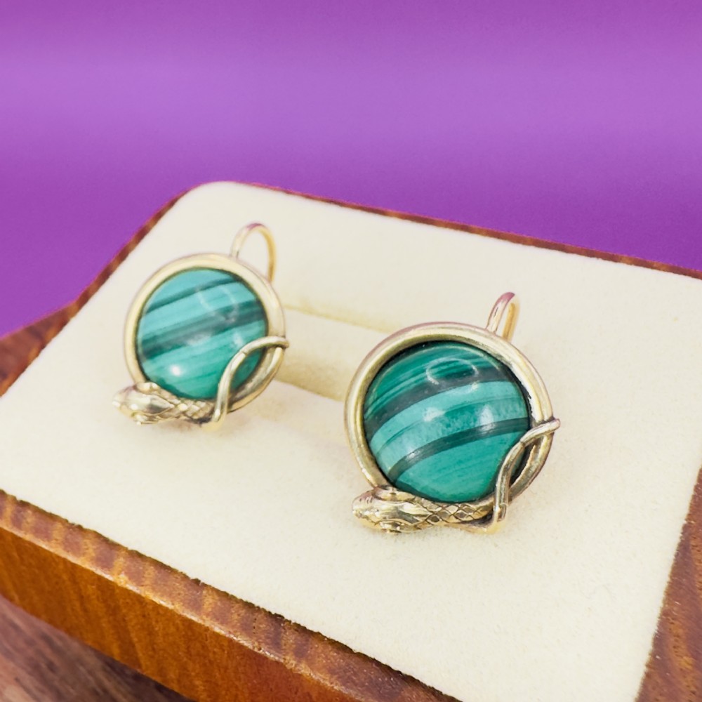 A pair of Victorian 15ct gold drop earrings featuring circular banded green malachite cabochons wrapped in a detailed serpent design.